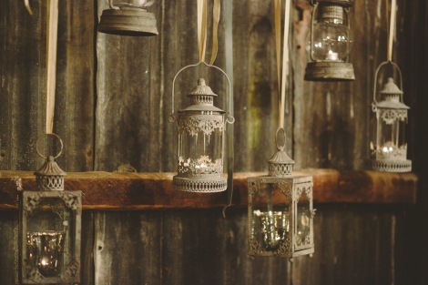 Hanging vintage lanterns as a backdrop behind the main table